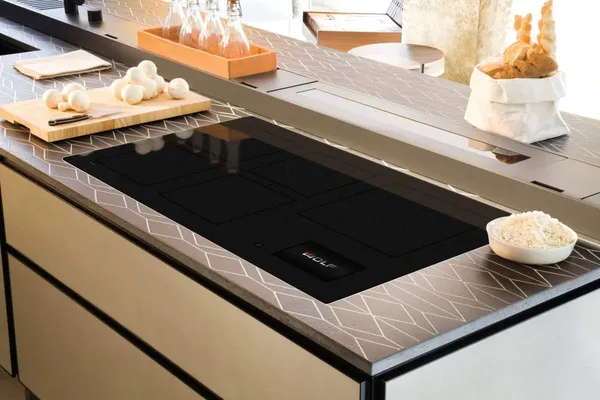 A close-up of the Wolf CI36560C/B induction cooktop